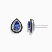 The Nahla Siri 14K Gold Tanzanite and Diamond Earrings, 1.54 TCW, feature teardrop-shaped studs with vivid blue tanzanite centers and a halo of sparkling white and black diamonds, set in luxurious gold against a white background.