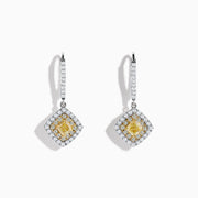 The Canare 18K Two-Tone Gold Cushion Shaped Double Halo Yellow Diamond Drop Earrings feature a square yellow diamond center, two halos of white diamonds, and a diamond-encrusted hoop for an elegant look.
