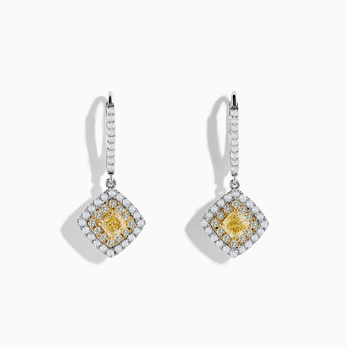 The Canare 18K Two-Tone Gold Cushion Shaped Double Halo Yellow Diamond Drop Earrings feature a square yellow diamond center, two halos of white diamonds, and a diamond-encrusted hoop for an elegant look.