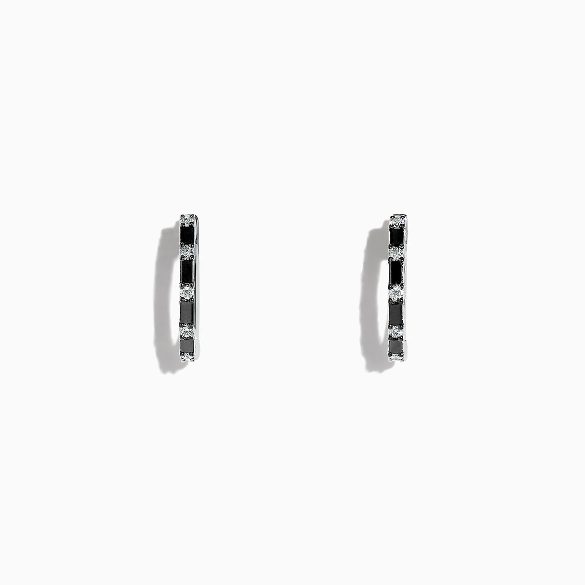 A pair of 14K white gold hoop earrings with black and white diamonds totaling 0.45 TCW, showcased against a plain white background. Effy craftsmanship enhances the modern elegance of this striking jewelry piece.