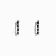 A pair of 14K white gold hoop earrings with black and white diamonds totaling 0.45 TCW, showcased against a plain white background. Effy craftsmanship enhances the modern elegance of this striking jewelry piece.