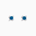 Bella Bleu 14K White Gold Blue Diamond Stud Earrings, 0.53 TCW, feature round blue gemstones set in white gold prongs and accented with four small clear stones on each earring, shown against a white background.