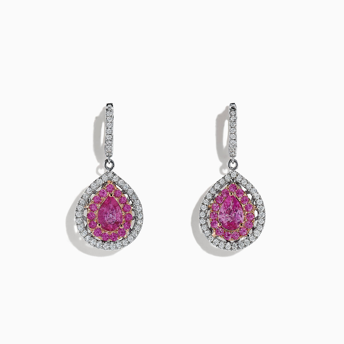 Experience elegance with these 14K two-tone gold drop earrings featuring pear-shaped pink sapphires and sparkling diamonds, totaling 2.73 carats. Perfectly crafted for a touch of luxurious sophistication.