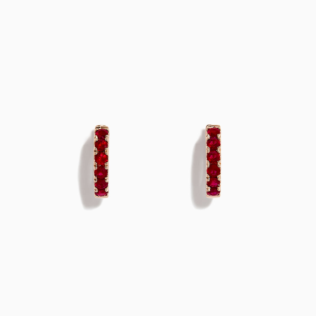 The Ruby Royale 14K Rose Gold Ruby Huggie Earrings (0.57 TCW) feature vibrant red rubies set in small rose gold hoops by Effy, shown against a white background.