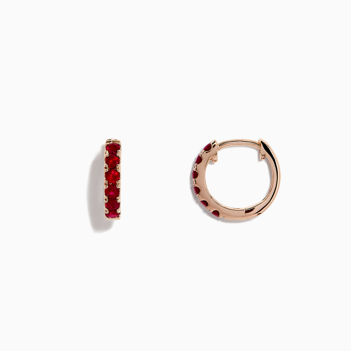 The Ruby Royale 14K Rose Gold Ruby Huggie Earrings (0.57 TCW) feature vibrant red rubies set in small rose gold hoops by Effy, shown against a white background.