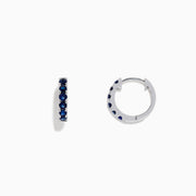 Royale Bleu 14K Gold Blue Sapphire Huggie Earrings, 0.57 TCW, displayed against a plain white background.