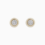 The Duo 14K Two Tone Gold 1/2 Diamond Halo Stud Earrings feature a central diamond cluster encircled by additional diamonds (0.69 TCW), set against a white background.