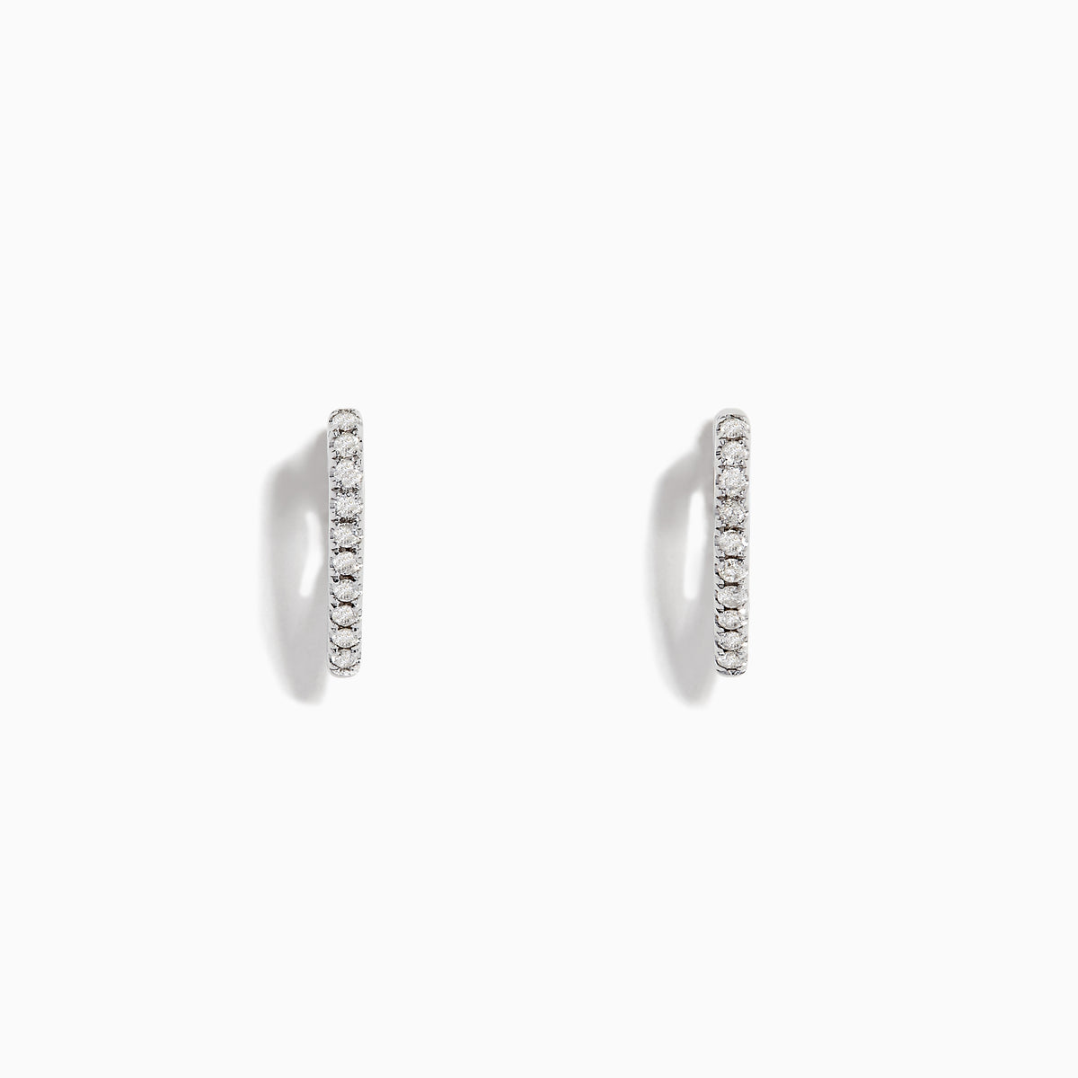 Pave Classica 14K White Gold Diamond Huggie Earrings, 0.22 TCW, are small, thin earrings encrusted with diamonds and shown on a white background with soft shadows.