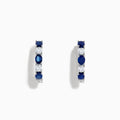 14K White Gold Multi Sapphire Hoop Earrings with alternating round blue sapphires and clear stones, shown on a white background.