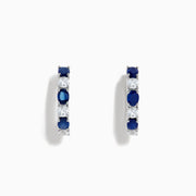 14K White Gold Multi Sapphire Hoop Earrings with alternating round blue sapphires and clear stones, shown on a white background.