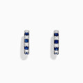 The Royale Bleu 14K White Gold Sapphire and Diamond Hoop Earrings feature alternating sapphire and diamond stones set in white gold, shown against a plain white background.