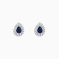 Royale Bleu 14K White Gold Pear Shaped Sapphire and Diamond Stud Earrings (2.23 TCW) feature dark blue sapphires at the center, encircled by two rows of sparkling diamonds in a white gold setting.