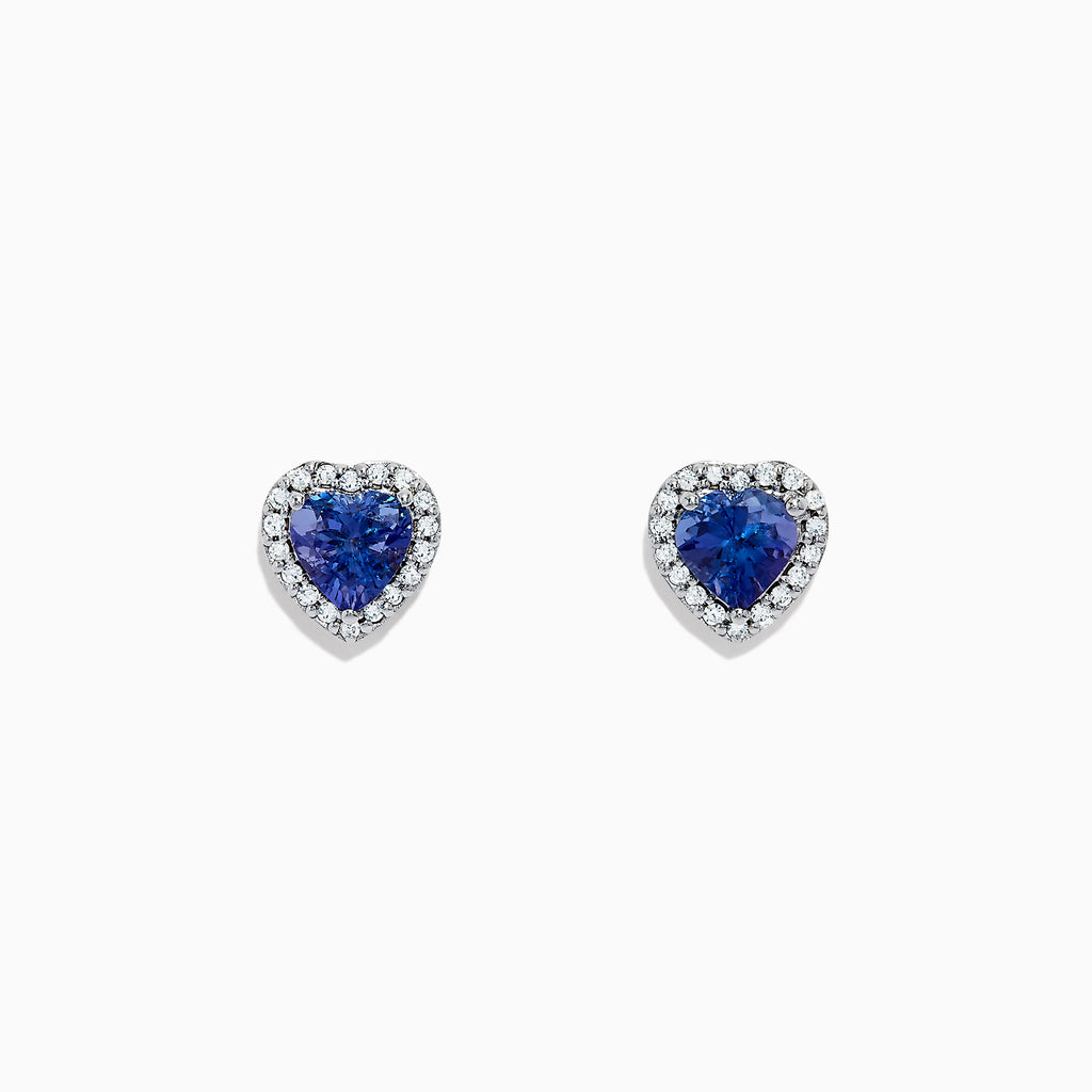 Nahla Siri 14K White Gold Tanzanite and Diamond Heart Earrings, 1.51 TCW, feature heart-shaped blue tanzanite gems bordered by sparkling diamonds. Shown on a plain white background.