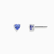 The Nahla Siri Sterling Silver Heart Shaped Tanzanite Stud Earrings are shown displayed on a plain white background.