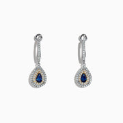 The Royale Bleu 14K Two Tone Gold Sapphire and Diamond Earrings, 0.93 TCW, feature sapphire teardrops encircled by diamonds, set in elegant two-tone gold and shown on a white background.