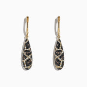These 14K yellow gold drop earrings feature teardrop pendants with an intricate espresso, black, and white diamond design, totaling 1.26 TCW.