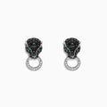 The Signature 14K White Gold Black Diamond & Emerald Earrings, 0.84 TCW, feature panther heads encrusted with black diamonds and emerald eyes, each holding a diamond-studded hoop, set against a white background.