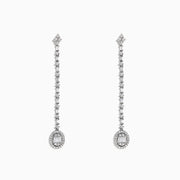 The Classique 14K White Gold Diamond Drop Earrings, 0.72 TCW, feature a linear design of sparkling diamonds ending in an oval-shaped, gem-encrusted drop on each elegant earring.