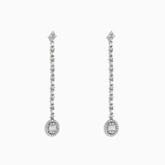 The Classique 14K White Gold Diamond Drop Earrings, 0.72 TCW, feature a linear design of sparkling diamonds ending in an oval-shaped, gem-encrusted drop on each elegant earring.