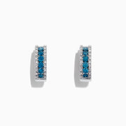 Bella Bleu 14K White Gold Hoop Earrings, 0.92 TCW, showcase a central row of blue and white diamonds bordered by small clear stones, presented against a white background.
