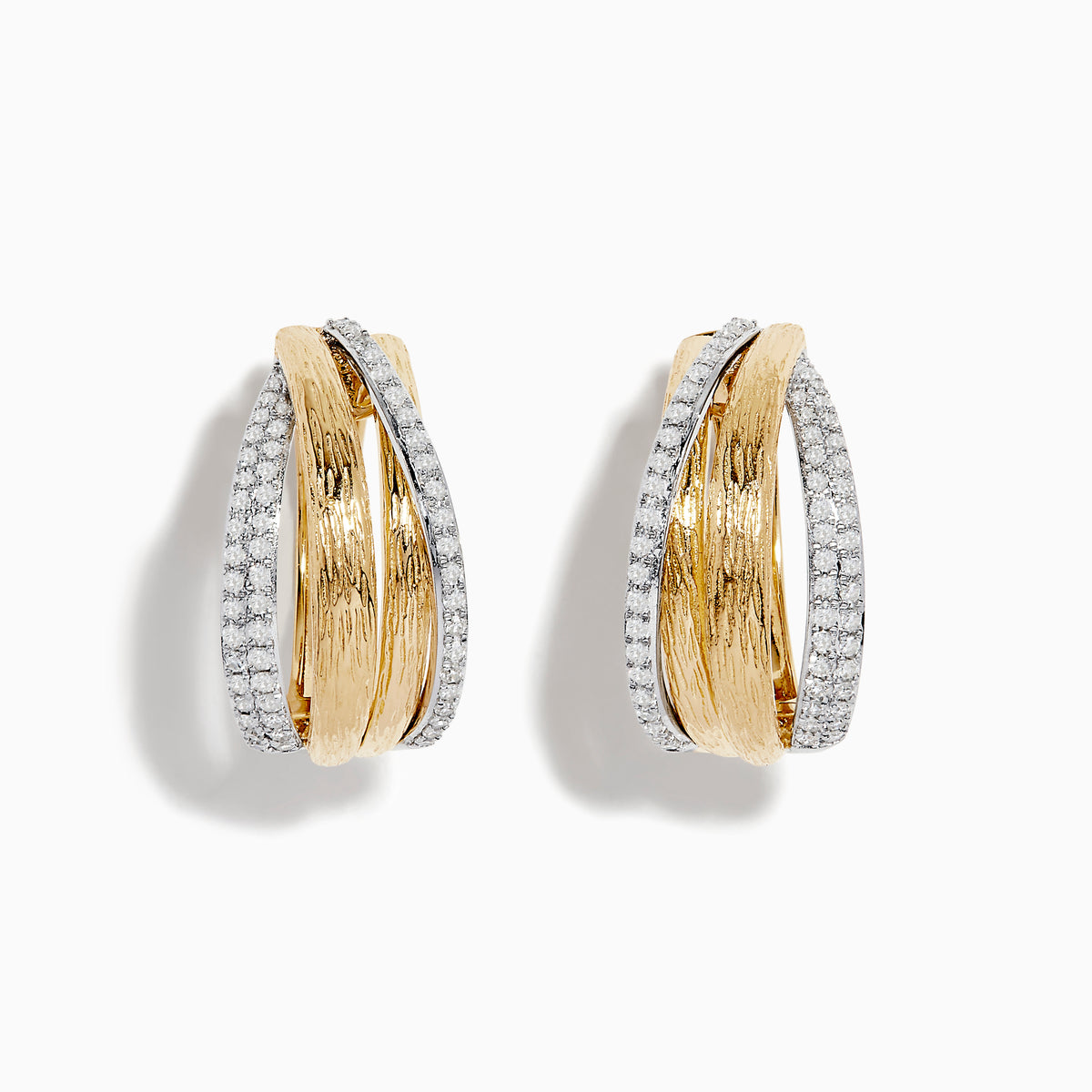 The Duo 14K Two-Tone Gold Diamond Hoop Earrings feature intertwined textured gold and sleek silver bands accented with sparkling diamonds, displayed against a white background.