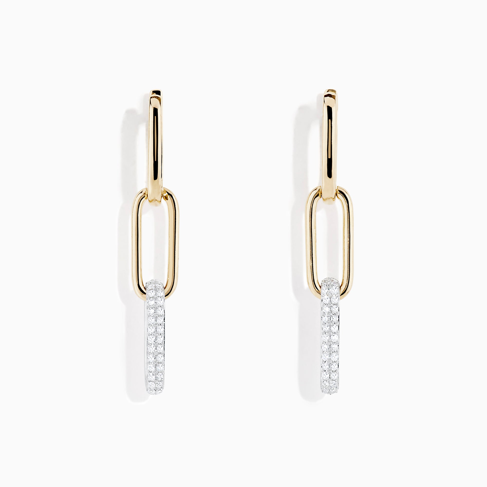The Duo 14K Two Tone Gold Diamond Drop Earrings feature two linked ovals—one in gold and the lower adorned with sparkling diamonds—creating a modern, elegant look.