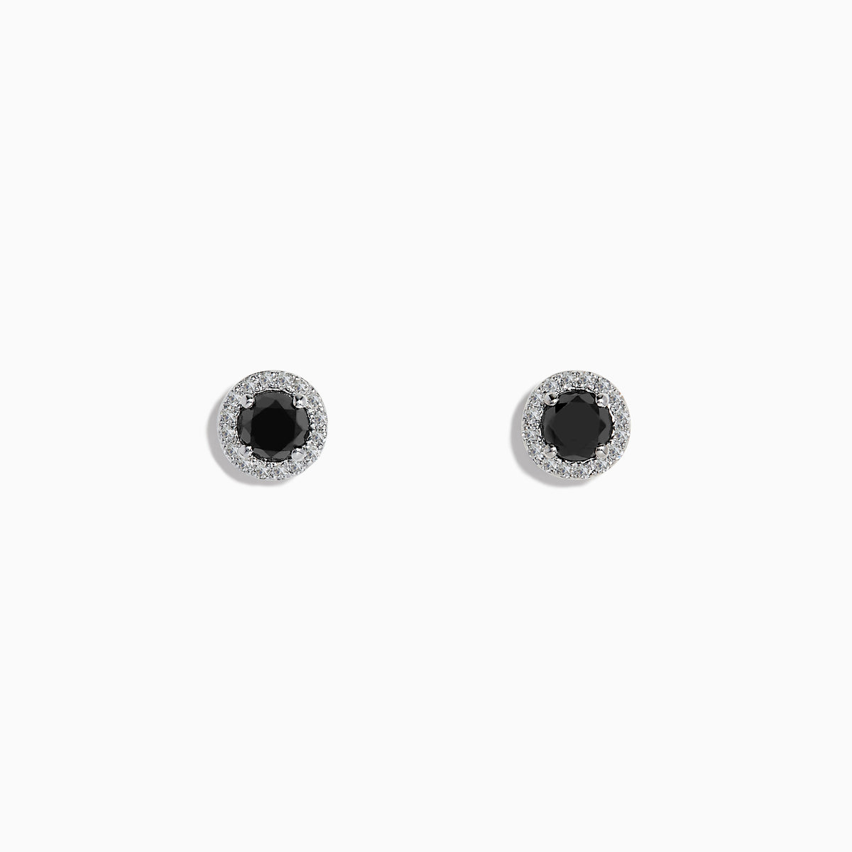 The Caviar 14K White Gold White and Black Diamond Stud Earrings feature black diamond centers encircled by white diamonds, shown on a plain white background.