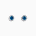 The Bella Bleu 14K Gold Blue and White Diamond Stud Earrings (0.71 TCW) feature deep blue stones surrounded by white diamonds, set in elegant gold and shown against a plain white background.