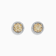 The Canare 14K Two Tone Gold Yellow Diamond Bouquet Halo Earrings feature a classic round design with a yellow diamond center and a halo of clear stones, totaling 0.98 carats.