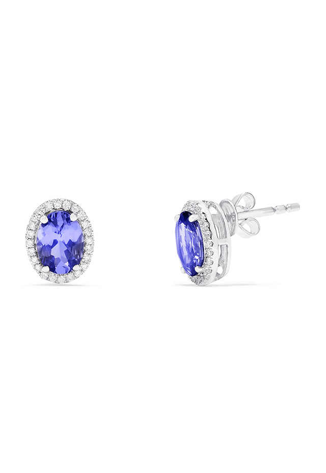 A pair of 14K white gold tanzanite and diamond stud earrings, 2.20 TCW, featuring vibrant oval blue tanzanites each encircled by sparkling diamonds.