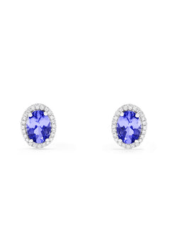 A pair of 14K white gold tanzanite and diamond stud earrings, 2.20 TCW, featuring vibrant oval blue tanzanites each encircled by sparkling diamonds.