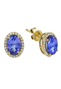The 14K Yellow Gold Tanzanite & Diamond Earrings, 2.20 TCW, showcase large oval tanzanite stones encircled by sparkling diamonds for a classic and timeless look.