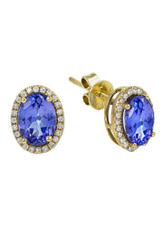 The 14K Yellow Gold Tanzanite & Diamond Earrings, 2.20 TCW, showcase large oval tanzanite stones encircled by sparkling diamonds for a classic and timeless look.