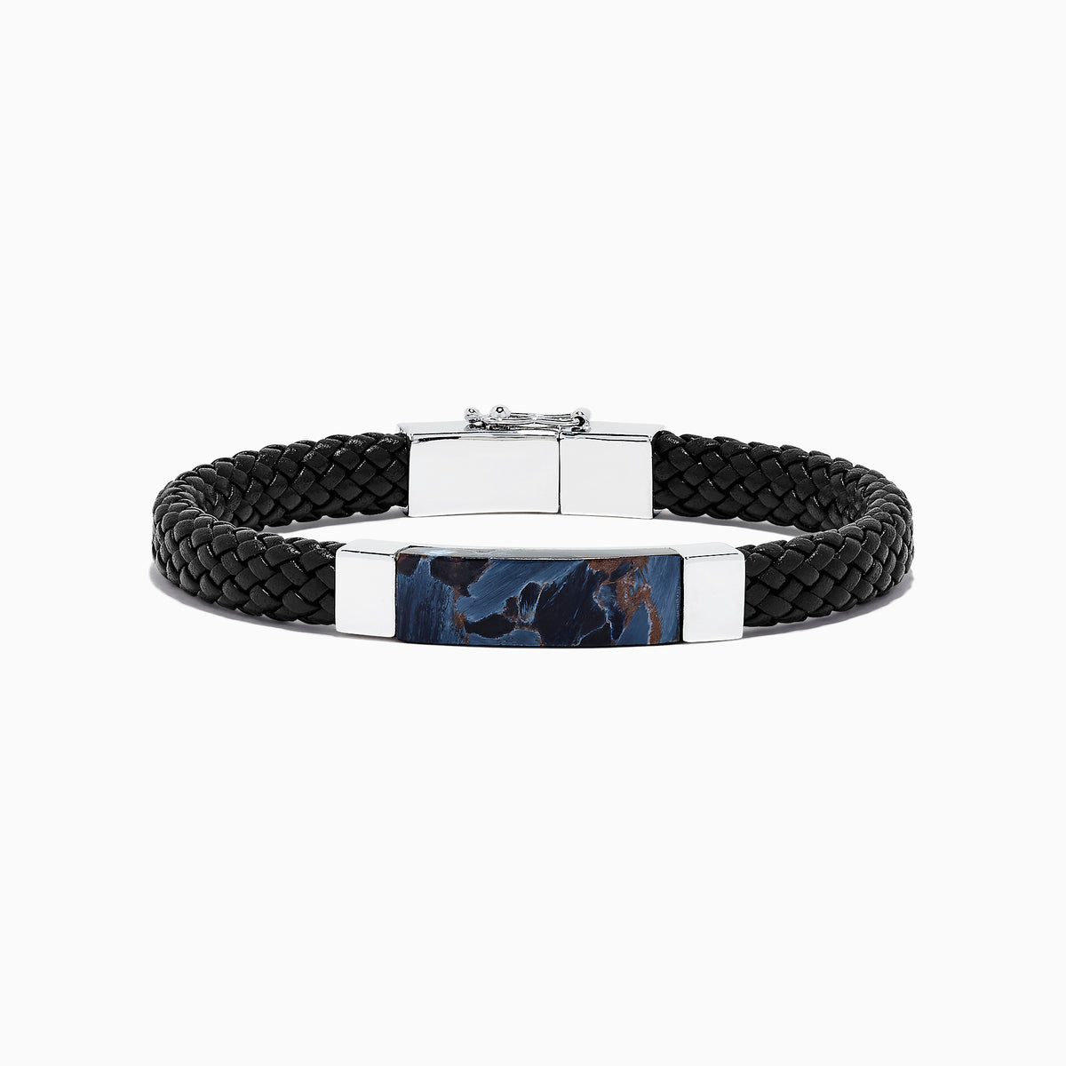 The Mens Sterling Silver Pietersite Woven Leather Bracelet, 12.50 TCW, features black woven leather, a sterling silver clasp, and a rectangular silver accent with a dark blue pietersite marbled center, shown on a white background.