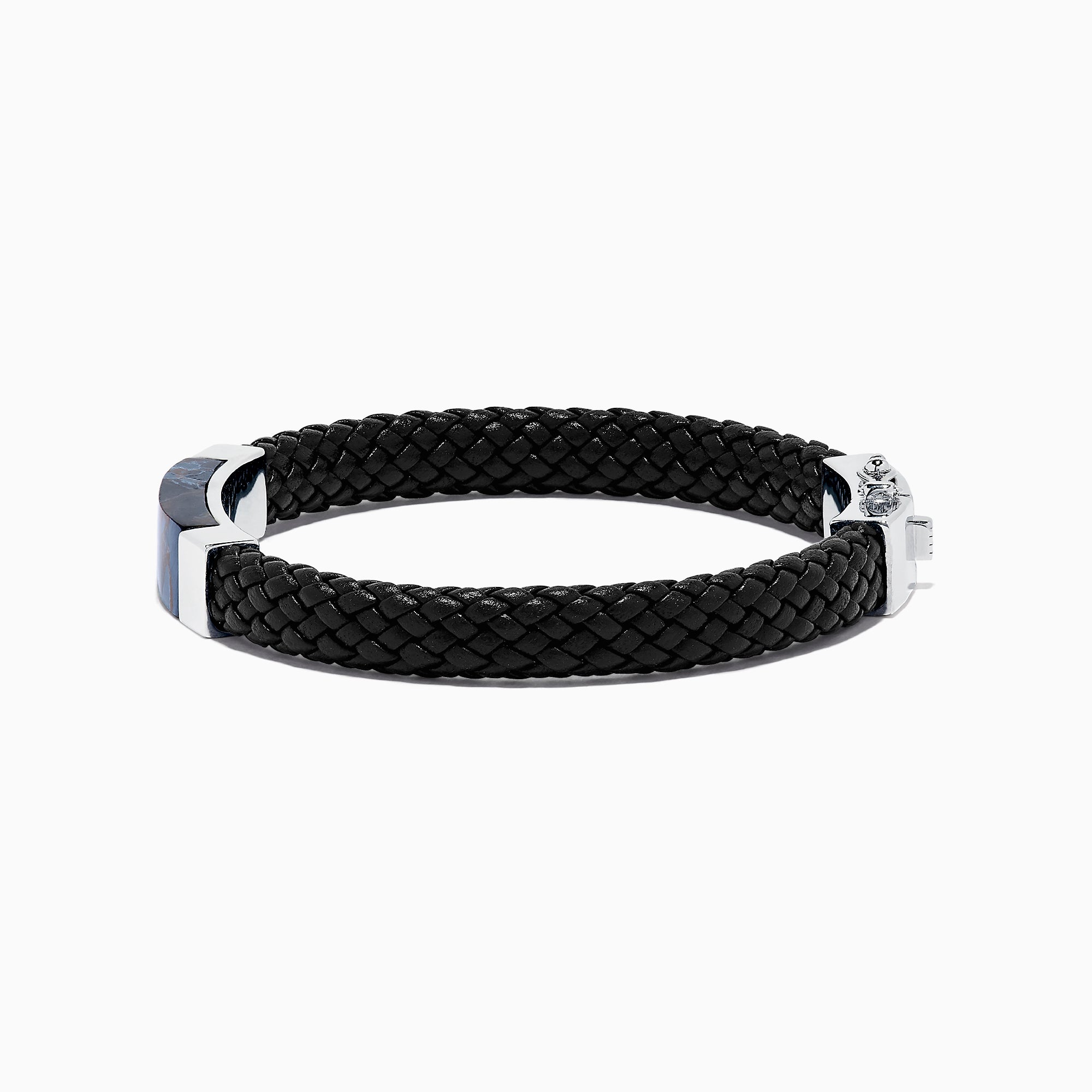 The Mens Sterling Silver Pietersite Woven Leather Bracelet, 12.50 TCW, features black woven leather, a sterling silver clasp, and a rectangular silver accent with a dark blue pietersite marbled center, shown on a white background.