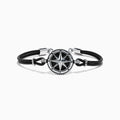 The Mens Sterling Silver Onyx Compass Leather Bracelet, 4.00 TCW, features a black cord with a round sterling silver compass rose charm, silver accents, and a clasp, shown on a white background.