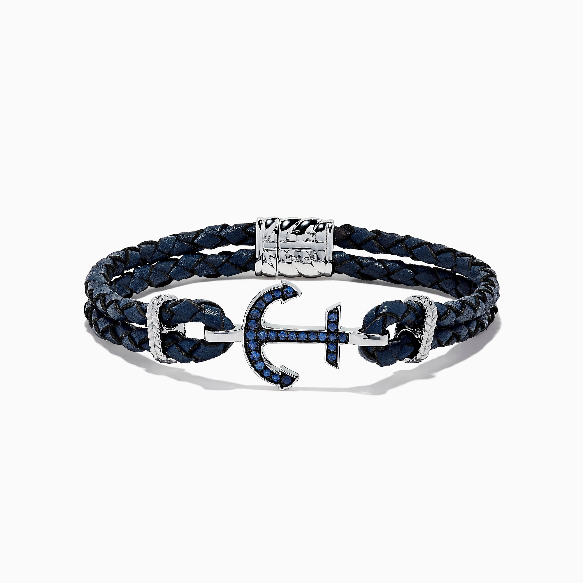 The Mens Sterling Silver Woven Leather Sapphire Anchor Bracelet, 0.52 TCW, features navy blue braided leather and a sterling silver anchor clasp set with sapphire gemstones.
