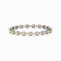 The Canare 18K Gold Yellow & White Diamond Tennis Bracelet, 4.71 TCW, showcases alternating square yellow and round white diamonds for a stunning, eye-catching pattern against a sleek white background.