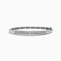 The 925 Sterling Silver Diamond Bangle, 0.50 TCW, features a central section adorned with sparkling diamonds and is displayed against a plain white background.