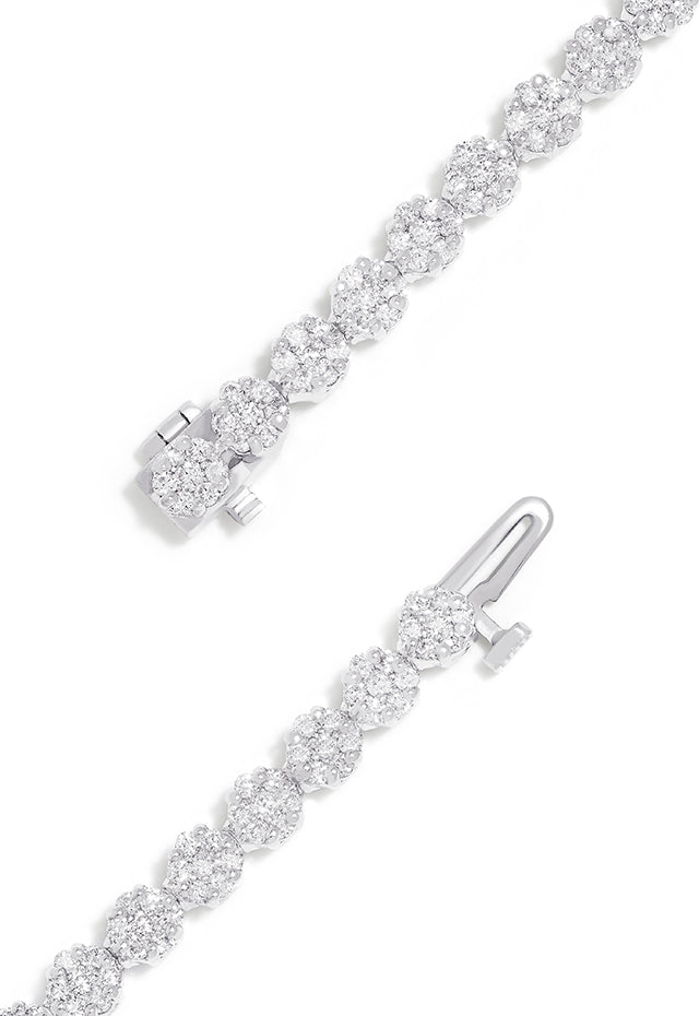 The Bouquet 14K White Gold Diamond Flower Tennis Bracelet features 3.14 TCW of sparkling diamonds in a sleek, continuous floral design.