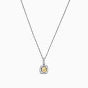 The Canare 18K Two-Tone Gold Cushion Cut Yellow Diamond Pendant (0.52 TCW) features a yellow diamond in a cushion cut, haloed by clear stones and suspended from a fine two-tone gold chain.