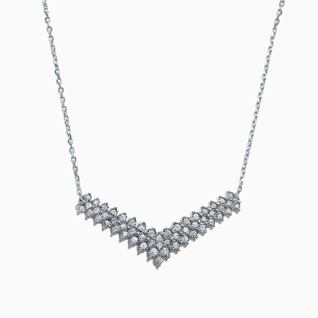 The 925 Sterling Silver Diamond Necklace features a V-shaped pendant with two rows of round diamonds, set at the chain’s base for maximum brilliance and a total carat weight of 0.47 TCW.