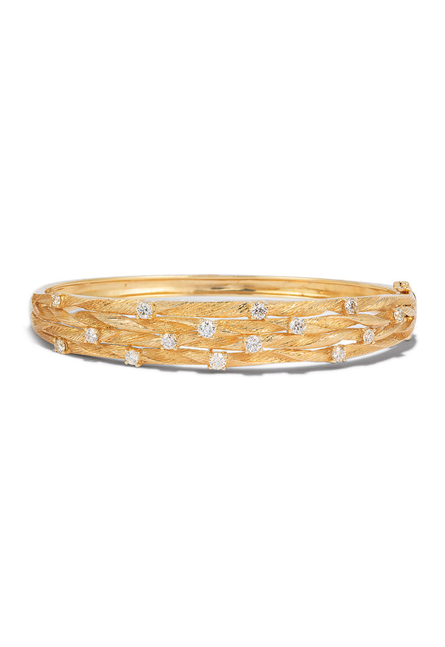 The DOro 14K Textured Yellow Gold Diamond Bangle (1.01 TCW) features a leaf-patterned design and is accented with round white diamonds for extra sparkle.