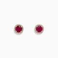 Ruby Royale 14K Yellow Gold Round Diamond Halo Ruby Stud Earrings, 1.27 TCW, feature vibrant red rubies at the center of each stud, surrounded by a sparkling diamond halo, all set against a plain white background.