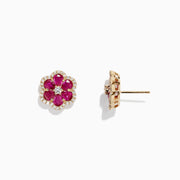 Ruby Royale 14K Yellow Gold Ruby Flower Stud Earrings, 3.18 TCW, feature bloom-shaped studs with six deep pink ruby petals encircling small clear stones and a central stone, all set in gold-tone metal.