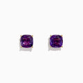 A pair of 14K Yellow Gold Amethyst Stud Earrings, 4.25 TCW, with cushion-cut gems set in prongs, displayed against a plain white background.