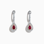 Ruby Royale 14K Two Tone Gold Pear Shaped Ruby Drop Earrings, 0.87 TCW, feature pear-shaped red rubies surrounded by two rows of white diamonds and diamond accents on the hooks, set in gold and shown on a white background.