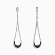 These 14K White Gold Black and White Diamond Drop Earrings (1.70 TCW) feature an open, elegant design with a sleek, sophisticated look, showcased against a white background.