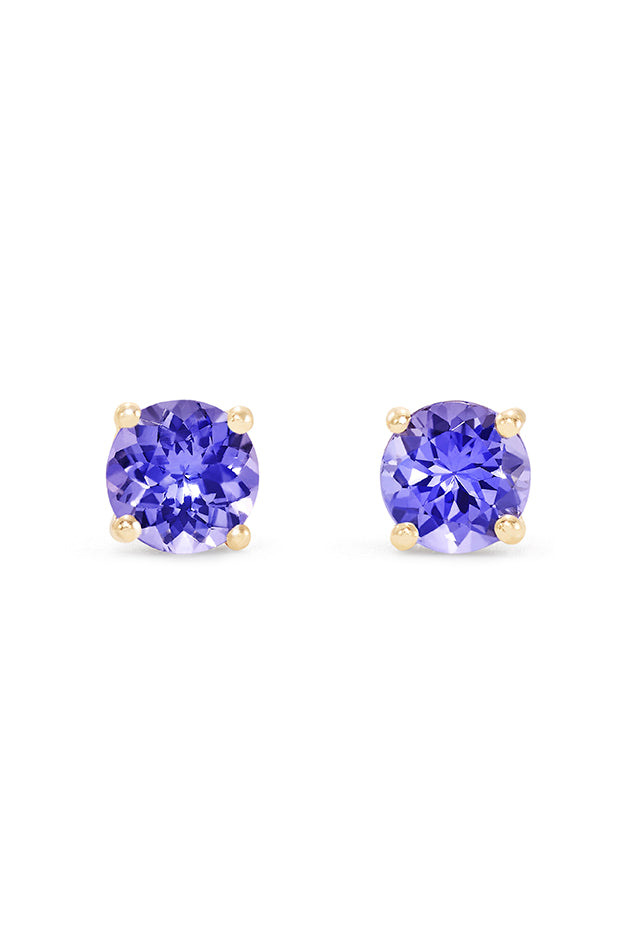 The 14K Yellow Gold Round Tanzanite Stud Earrings feature 0.65 TCW faceted stones in classic four-prong settings, shown against a white background.