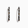 A pair of 14K rose gold hoop earrings featuring leopard spots and 0.78 TCW diamonds in black, brown, and white, set against a white background.
